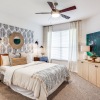 a bedroom with a fan