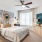 a bedroom with a fan