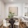 a dining room with a table and chairs